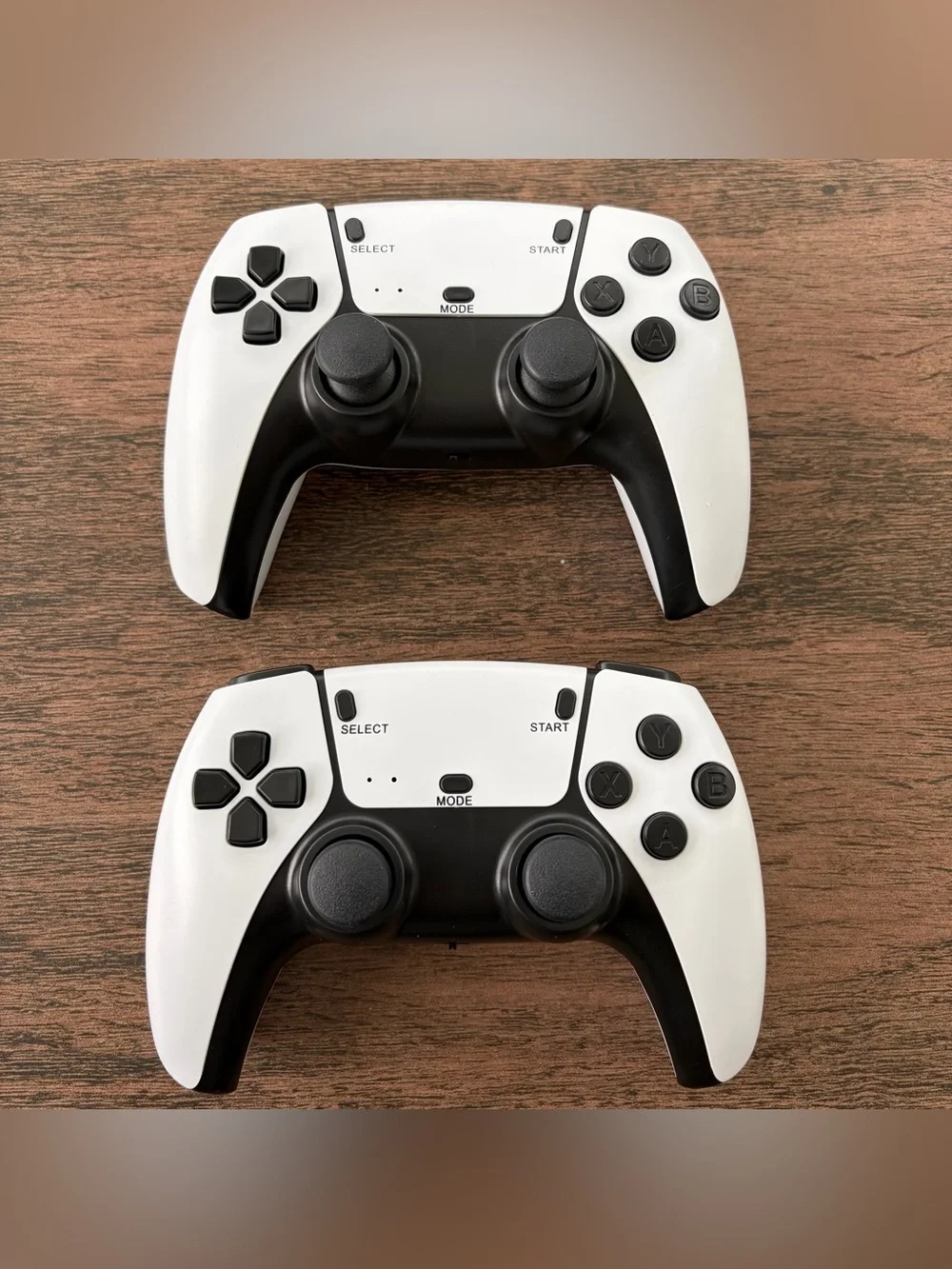 Pair of White & Black Wireless Game Controllers